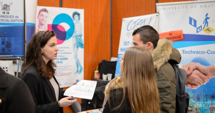 Exhibitor speaking to visitor