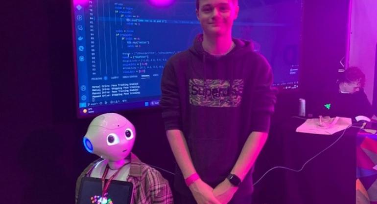 Image of Leeds City College student with Pepper robot 