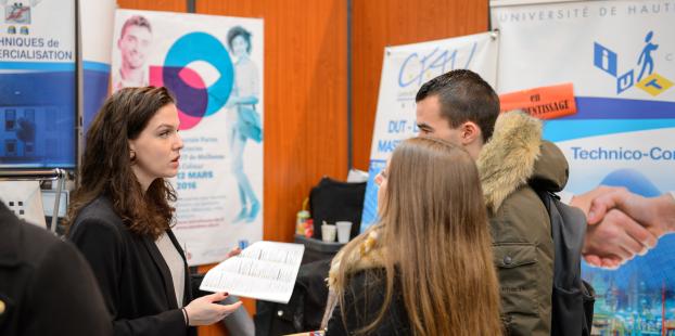Exhibitor speaking to visitor