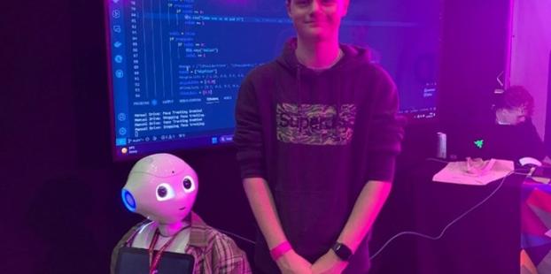 Image of Leeds City College student with Pepper robot 