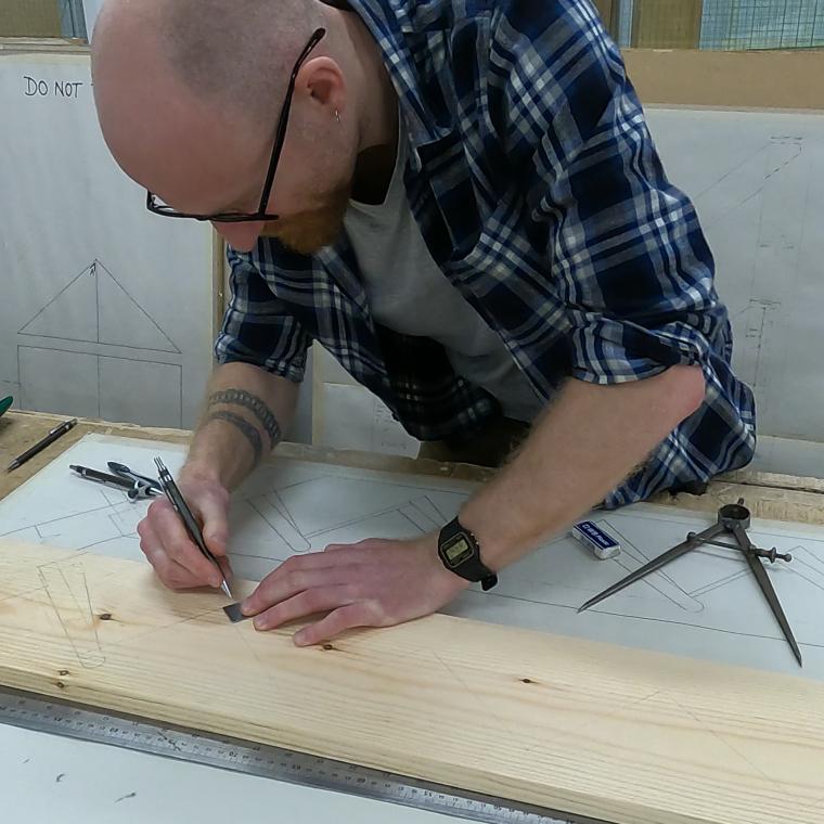 Man undertaking woodwork 